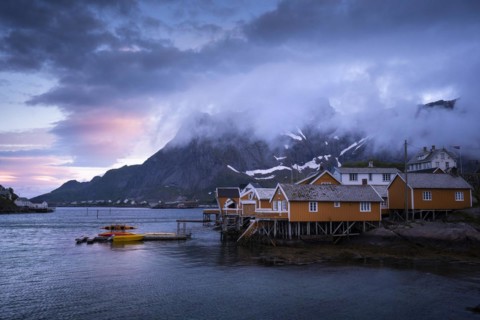 The village of Sakrisoy with its typical yellow or ochre-coloured wooden houses on wooden stilts