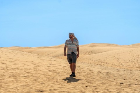Tourist man with turban in summer in the dunes of Maspalomas, Gran Canaria, Canary Islands
