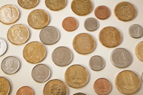 Portrait of Queen Elizabeth II on Canadian one dollar, twenty five, ten, five and one cent coins on