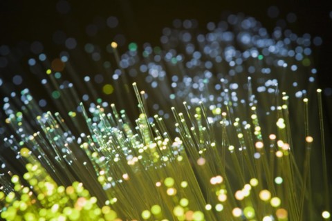 Close-up of yellow, blue and green lighted fiber optic cables, Studio Composition, Quebec, Canada,
