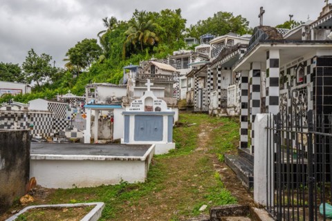 Famous cemetery, many mausoleums or large tombs decorated with tiles, often in black and white.
