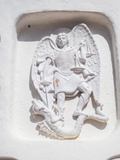 Stone sculpture, St George as dragon slayer, relief on the facade of the Stella Maris church, Porto