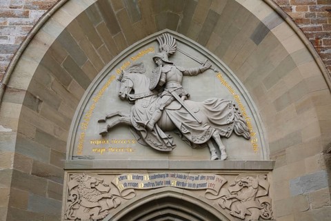 Eagle Gate, stone relief on the outer castle gate, knight figure on horse, armour, inscription,