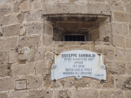 Plaque dedicated to Guiseppe Garibaldi at the Torre di Garibaldi, tower of the fortress, Alghero,
