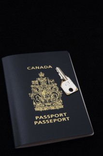 Close-up of chrome key on top of Canadian passport on black background, Studio Composition, Quebec,