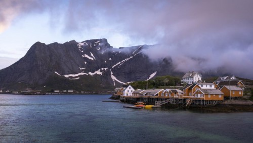 The village of Sakrisoy with its typical yellow or ochre-coloured wooden houses on wooden stilts