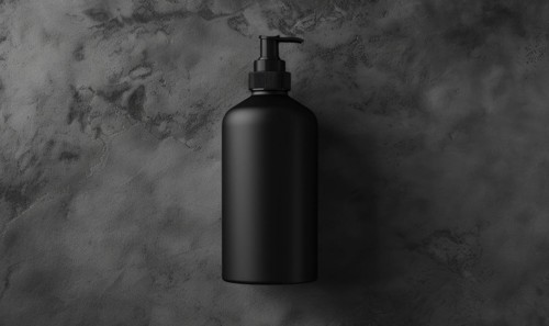 Studio shot of a matte black glass bottle mockup showcasing a product, minimalist branding AI