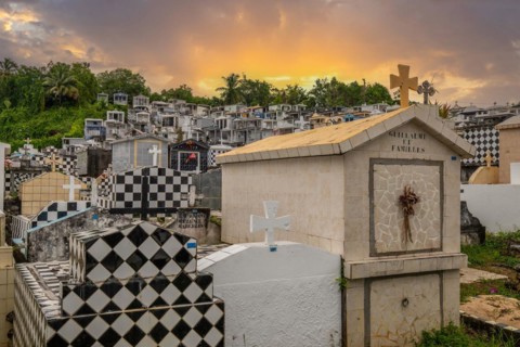 Famous cemetery, many mausoleums or large tombs decorated with tiles, often in black and white.