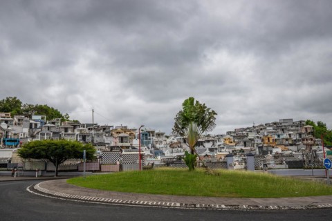 Famous cemetery, many mausoleums or large tombs decorated with tiles, often in black and white.