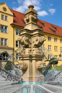 Fountain with lion heads, stone figures, Winnental Castle built in the 15th century by the Teutonic