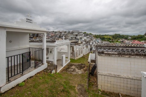 Famous cemetery, many mausoleums or large tombs decorated with tiles, often in black and white.