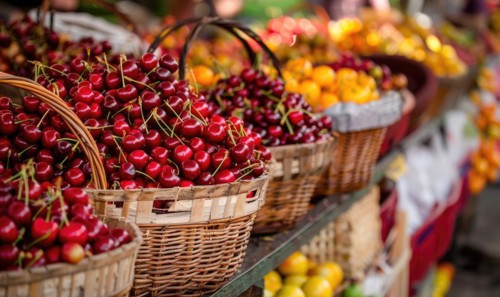 Closeup view of rip cherries selling on city market AI generated