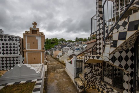 Famous cemetery, many mausoleums or large tombs decorated with tiles, often in black and white.