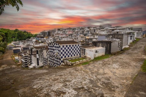 Famous cemetery, many mausoleums or large tombs decorated with tiles, often in black and white.