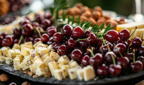 Ripe cherries arranged on a platter with cheese and nuts AI generated