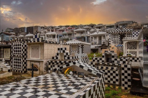 Famous cemetery, many mausoleums or large tombs decorated with tiles, often in black and white.