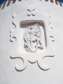 Stone sculpture, St George as dragon slayer, relief on the facade of the Stella Maris church, Porto