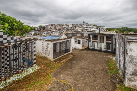 Famous cemetery, many mausoleums or large tombs decorated with tiles, often in black and white.