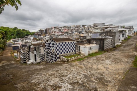 Famous cemetery, many mausoleums or large tombs decorated with tiles, often in black and white.