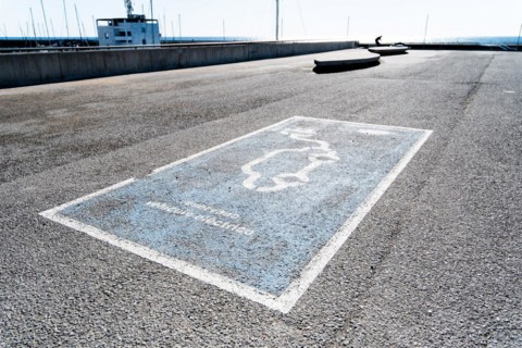 Parking space for an electric car on the beach in Barcelona, Spain, Europe