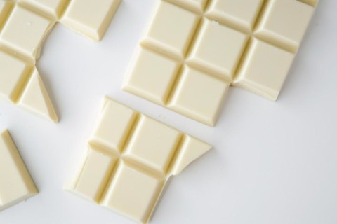 Broken up white chocolate bars, AI generated