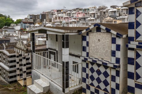 Famous cemetery, many mausoleums or large tombs decorated with tiles, often in black and white.