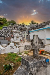 Famous cemetery, many mausoleums or large tombs decorated with tiles, often in black and white.