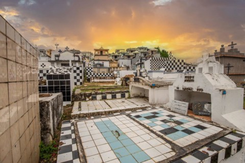 Famous cemetery, many mausoleums or large tombs decorated with tiles, often in black and white.