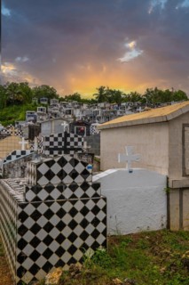 Famous cemetery, many mausoleums or large tombs decorated with tiles, often in black and white.
