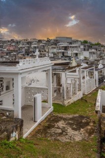 Famous cemetery, many mausoleums or large tombs decorated with tiles, often in black and white.