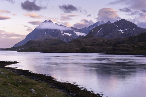 Mountain landscape on the Lofoten Islands. View from Flakstadoya across the sea to Moskenesoya. At