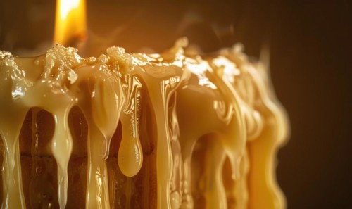 Close-up of a melting candle with wax dripping down the side AI generated
