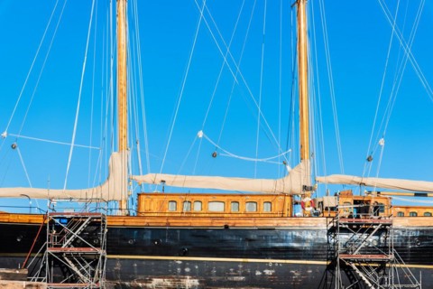 Old sailing ship in a shipyard in the old harbour of Barcelona, Spain, Europe