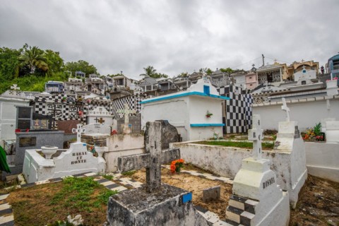 Famous cemetery, many mausoleums or large tombs decorated with tiles, often in black and white.