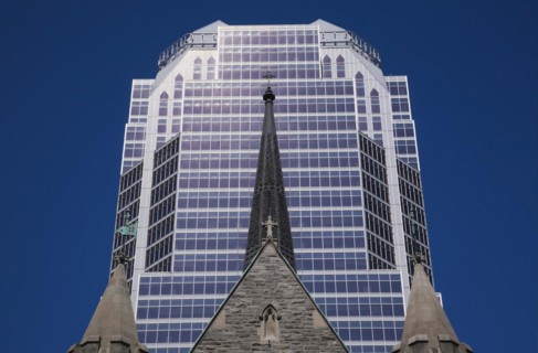 Old Christ Church Cathedral facade with spire and modern architectural steel and blue tinted glass