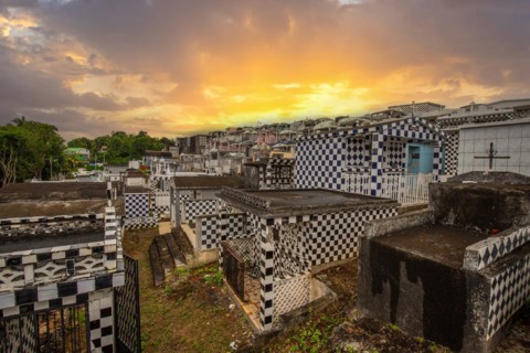 Famous cemetery, many mausoleums or large tombs decorated with tiles, often in black and white.