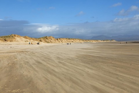 Sand blowing over beach, clouds, LLanddwyn Bay, Newborough, Isle of Anglesey, Wales, Great Britain