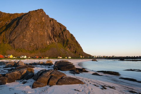 Landscape on the Lofoten Islands. The small village of Eggum, sandy beach, rocks, sea and mountain