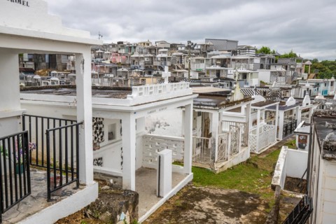 Famous cemetery, many mausoleums or large tombs decorated with tiles, often in black and white.