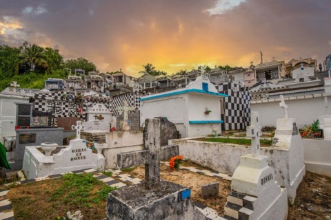 Famous cemetery, many mausoleums or large tombs decorated with tiles, often in black and white.