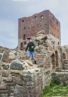 Boy run on Hammershus which was Scandinavia's largest medieval fortification and is one of the