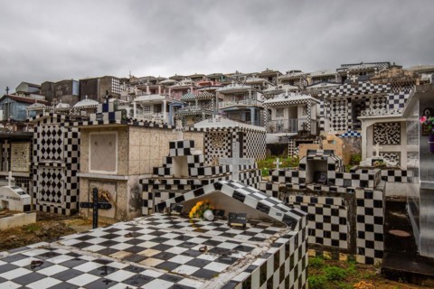 Famous cemetery, many mausoleums or large tombs decorated with tiles, often in black and white.