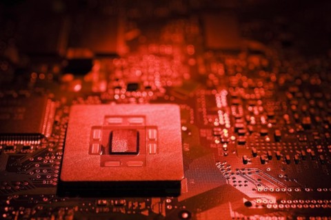 Close-up of red lighted microchip on electronic computer circuit board, Studio Composition, Quebec,
