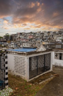 Famous cemetery, many mausoleums or large tombs decorated with tiles, often in black and white.