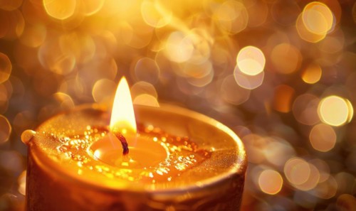 Close-up of a candle surrounded by a halo of light AI generated