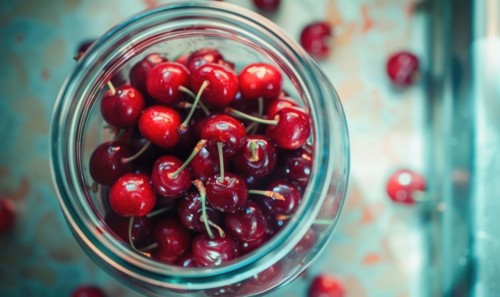 Ripe cherries showcased in a glass jar filled with clear syrup AI generated
