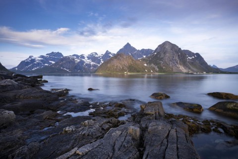Landscape with sea and mountains on the Lofoten Islands, view across the fjord to the small town of