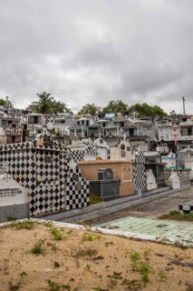 Famous cemetery, many mausoleums or large tombs decorated with tiles, often in black and white.