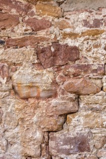 Wall made of sandstone, natural stone, quarry stone and mortar, background picture, old town,