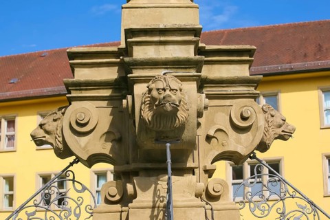 Fountain with lion heads, stone figures, Winnental Castle built in the 15th century by the Teutonic